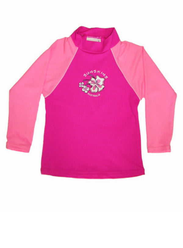 Girls Rash Shirt in chlorine resistant pink fabric with light pink long sleeves and a logo on the front.