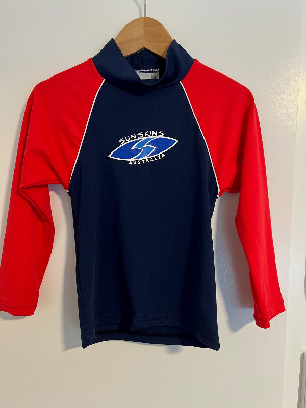 Red and navy Childs Rash Guard with Sunskins Australia logo