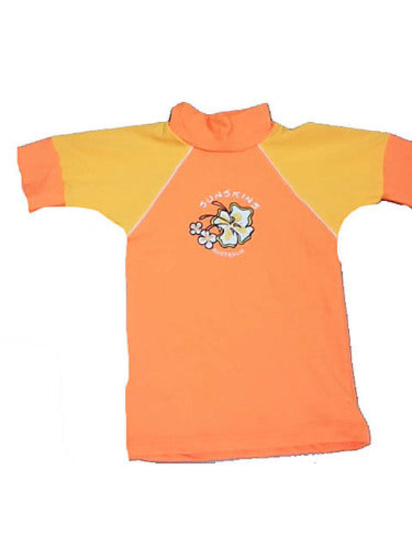 Girls Rash Shirt in chlorine resistant fabric, predominantly orange with yellow short sleeves, featuring a graphic on the front.