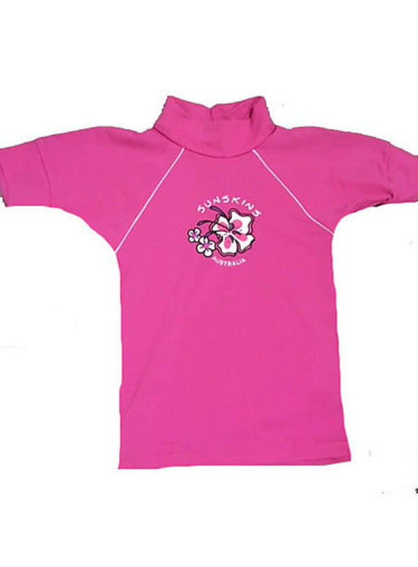 A pink chlorine resistant girls rash shirt with a floral logo on the front.