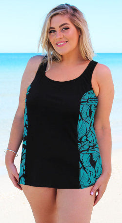 Woman wearing a black tank top with teal leaf patterns 